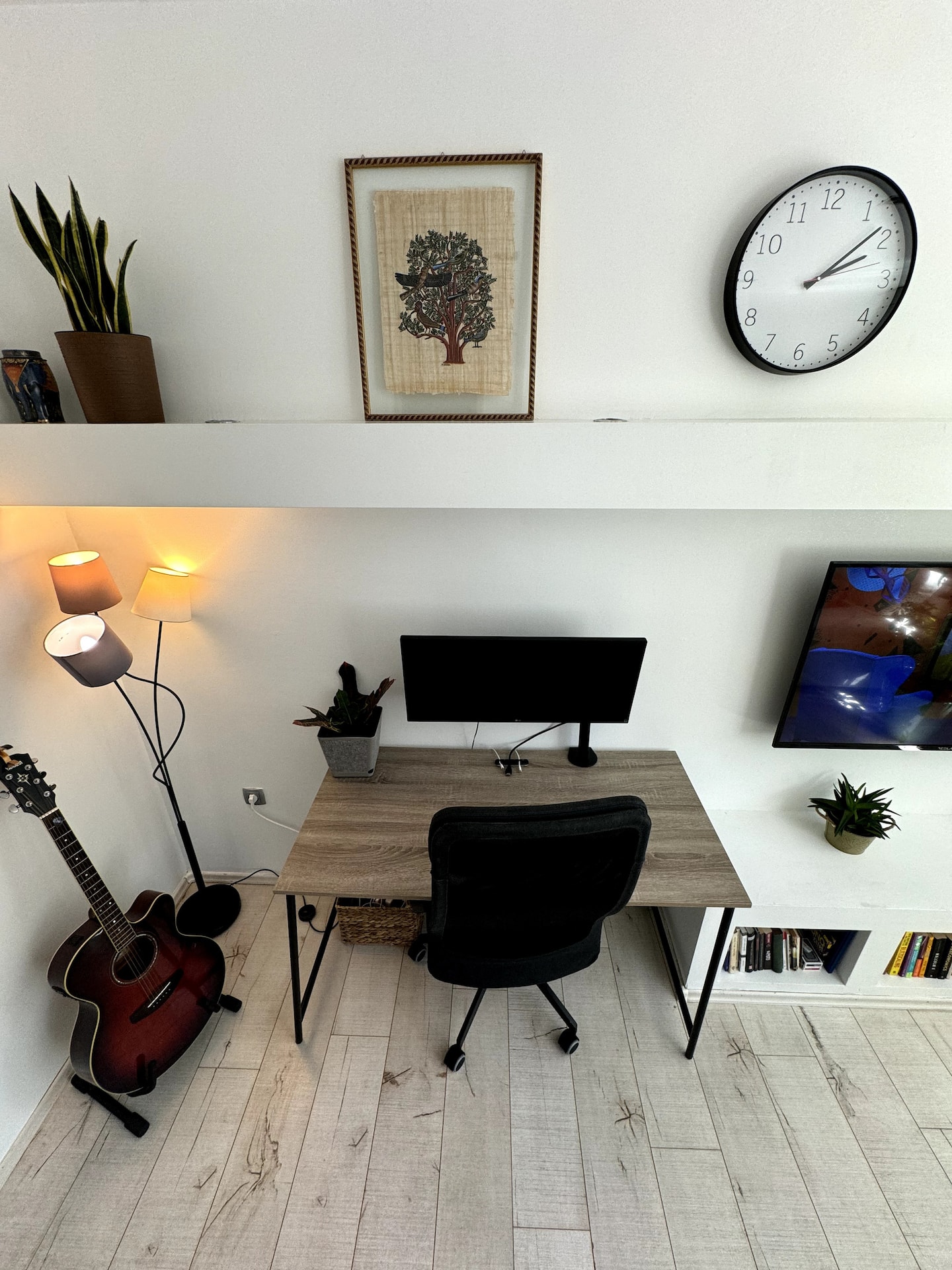 Dedicated workspace with a large external monitor and ergonomic chair